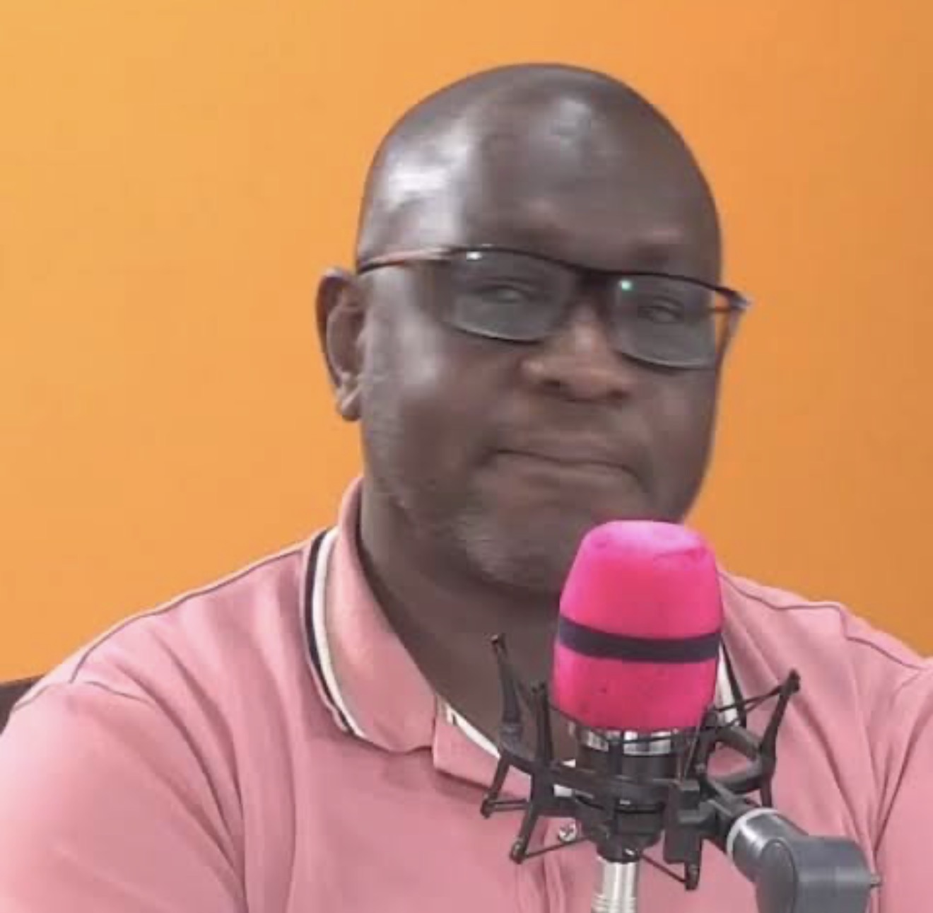 Portrait of Dr Ekuru Aukot, Kenyan constitutional lawyer and politician, speaking into a microphone